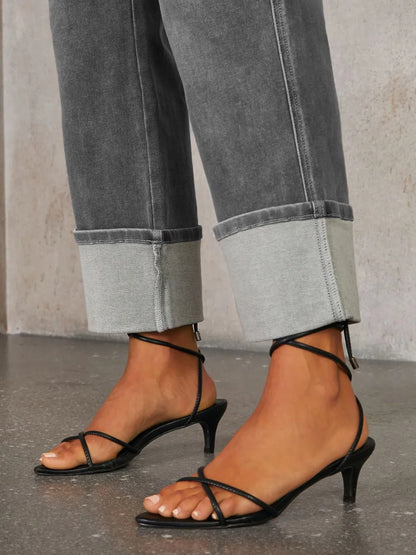High waisted straight leg rolled jeans by Trendsi, shown in a medium wash with a relaxed fit and cuffed hems.