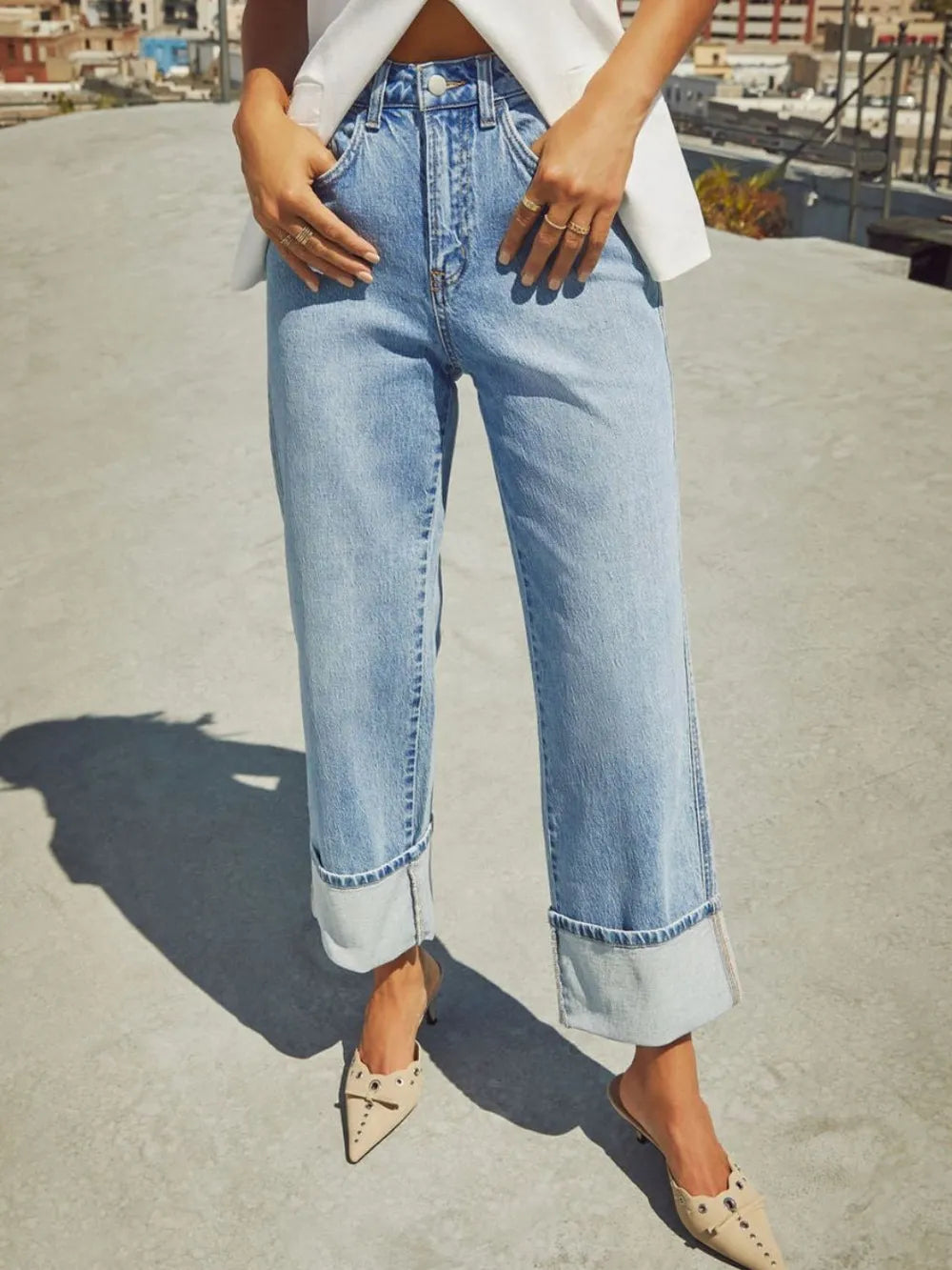 Medium shot of Trendsi high waisted straight leg rolled jeans displayed on a model, showcasing fit and denim texture.