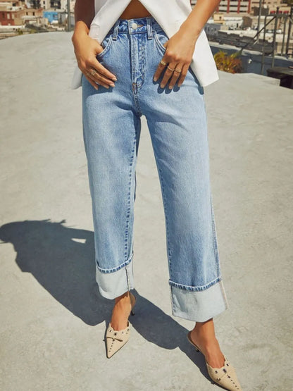 Medium shot of Trendsi high waisted straight leg rolled jeans displayed on a model, showcasing fit and denim texture.