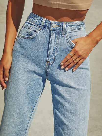 High waisted straight leg rolled jeans by Trendsi, showing a close-up of the denim fabric and rolled cuff detail