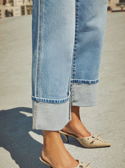 Medium wash high waisted straight leg rolled jeans by Trendsi, featuring classic denim with a relaxed fit and rolled cuff details.
