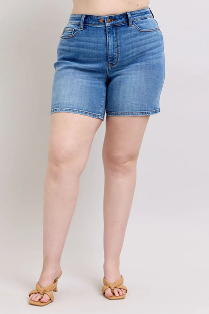Plus size Judy Blue denim shorts with two-button front and pockets, casual summer shorts in medium wash.