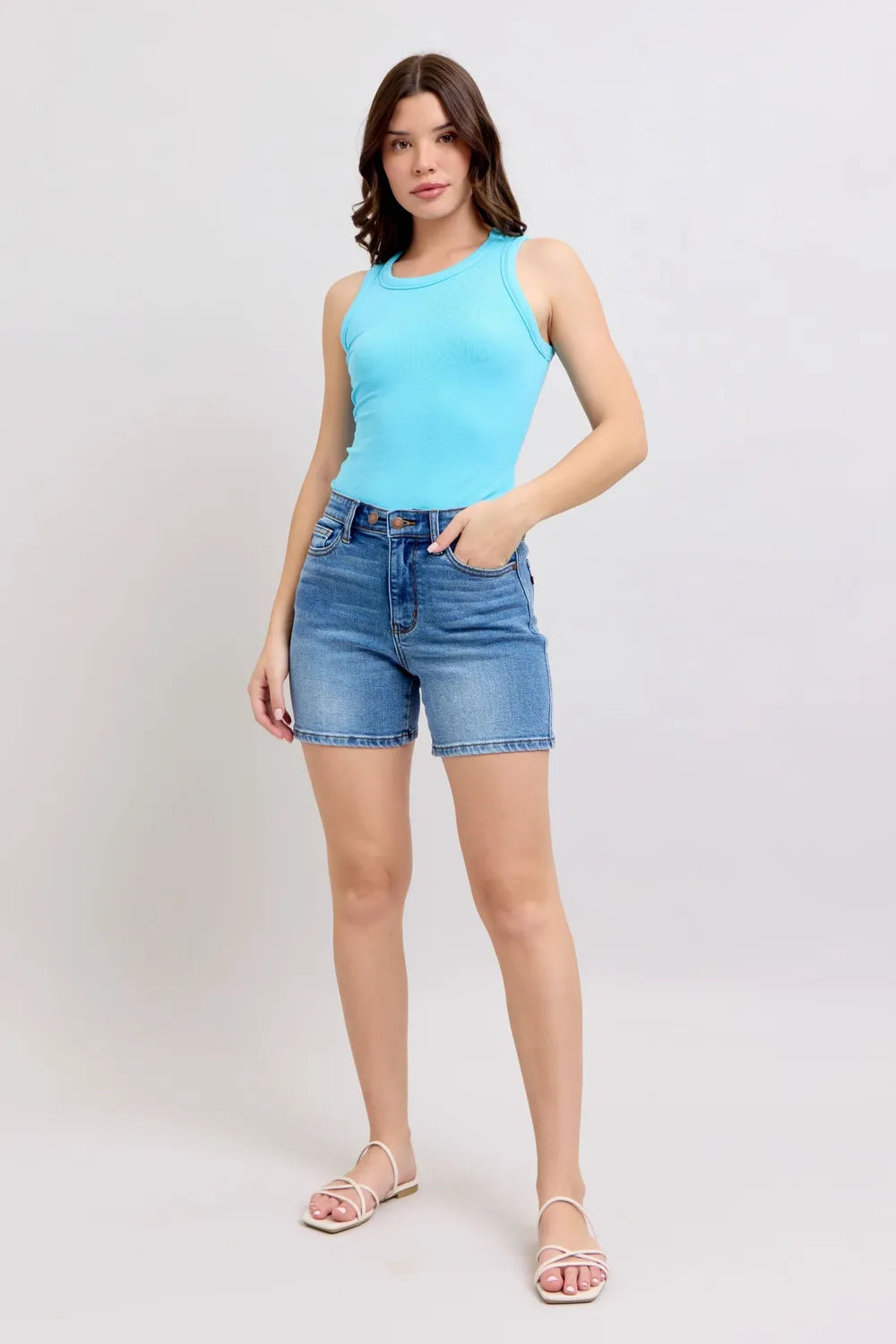 Plus size Judy Blue denim shorts with two buttons and pockets, featuring a stylish, casual fit for full-size women.