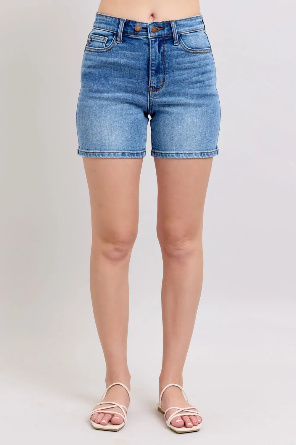 Plus size Judy Blue denim shorts with a 2-button front and pockets, featuring a stylish full-size fit.