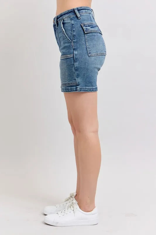 Plus size Judy Blue high-rise denim shorts featuring a classic blue wash and relaxed fit, perfect for casual summer wear.