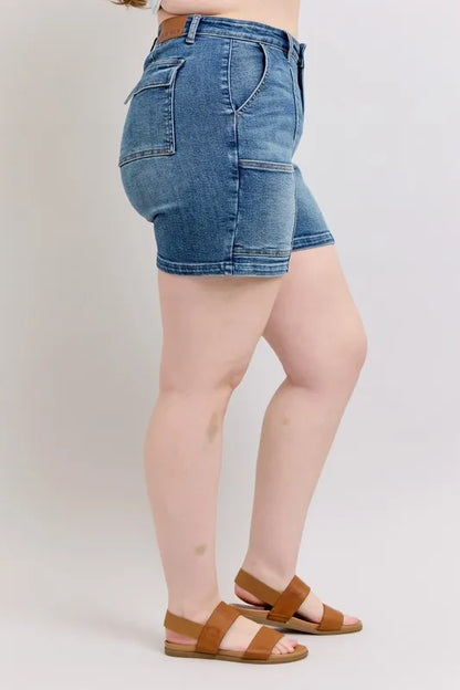Plus size Judy Blue high-rise denim shorts with a medium wash and classic five-pocket design, perfect for casual summer wear.