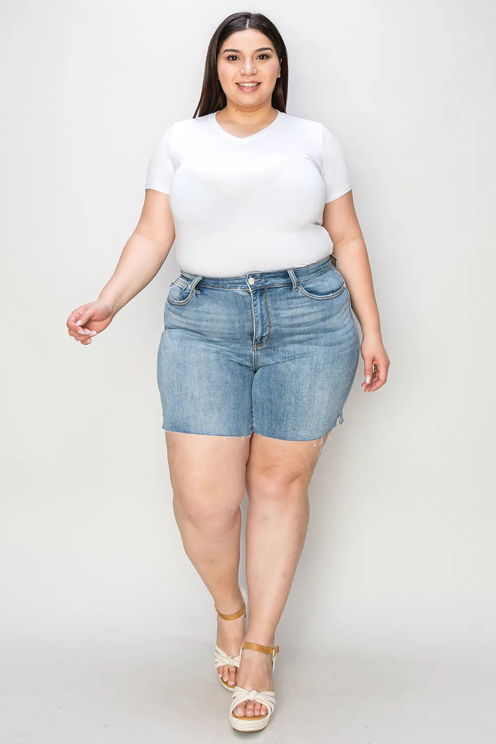 Trendy Judy Blue high waist raw hem denim shorts in full size, featuring a stylish distressed look and relaxed fit.