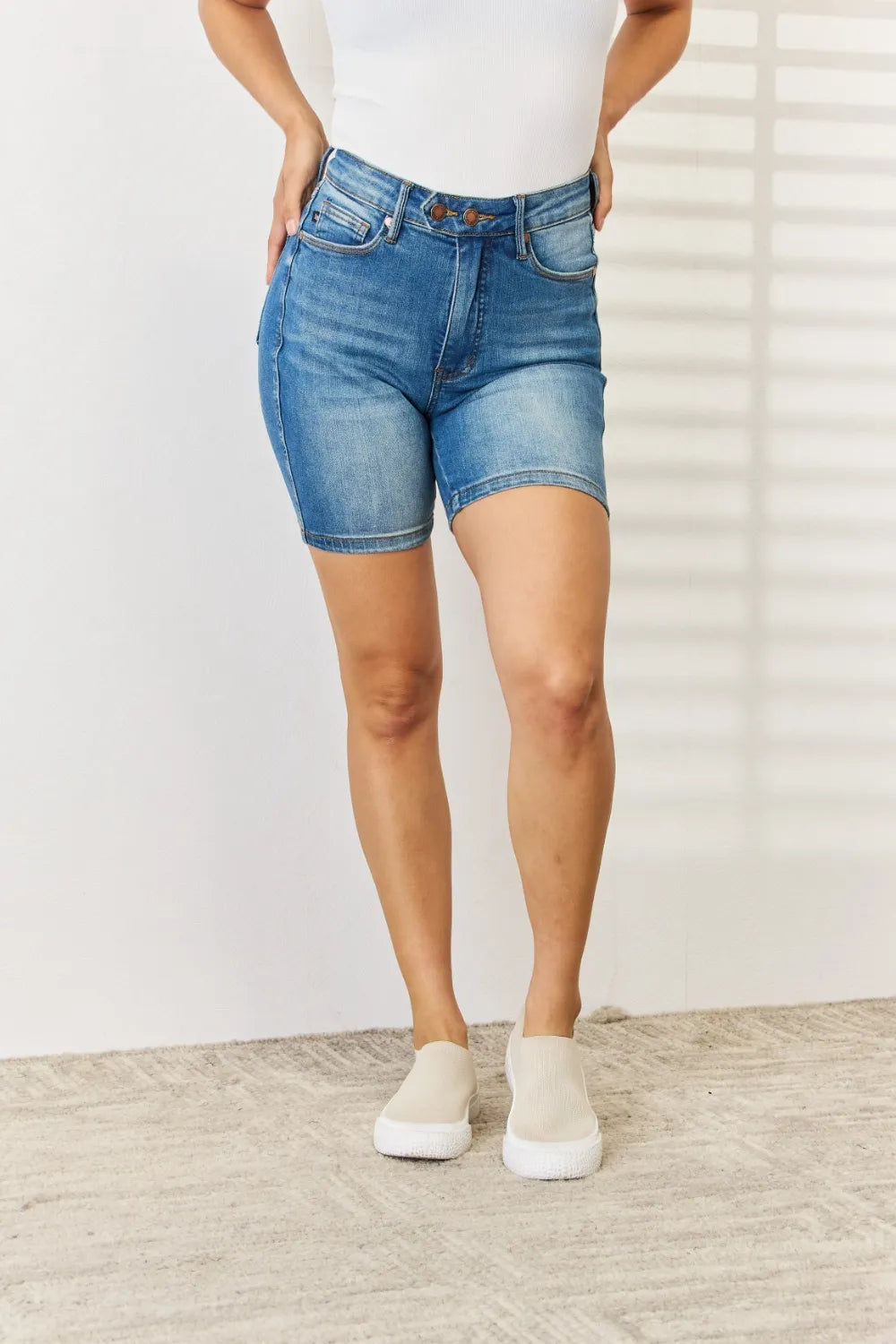 Judy Blue full-size denim Bermuda shorts with double button tummy control, medium wash, and rolled hem detail.