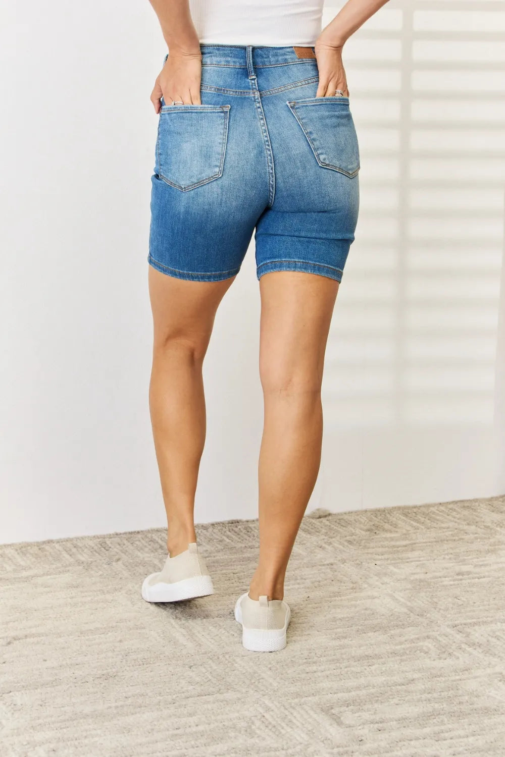 Judy Blue full-size denim Bermuda shorts with tummy control and double button closure, casual summer style.