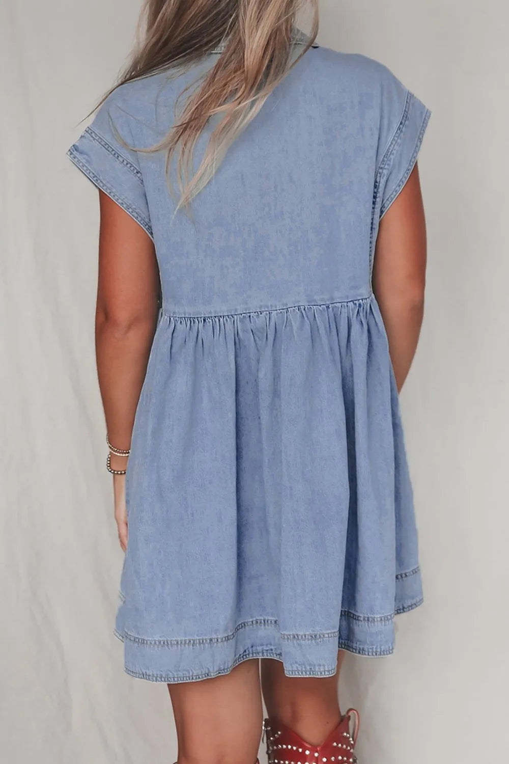 Denim babydoll dress with lapel neck and cap sleeves, trendy casual style from Trendsi, shown in medium size.