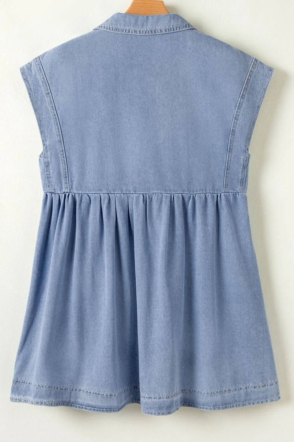 Medium-length denim babydoll dress with lapel collar and cap sleeves, stylishly designed by Trendsi.