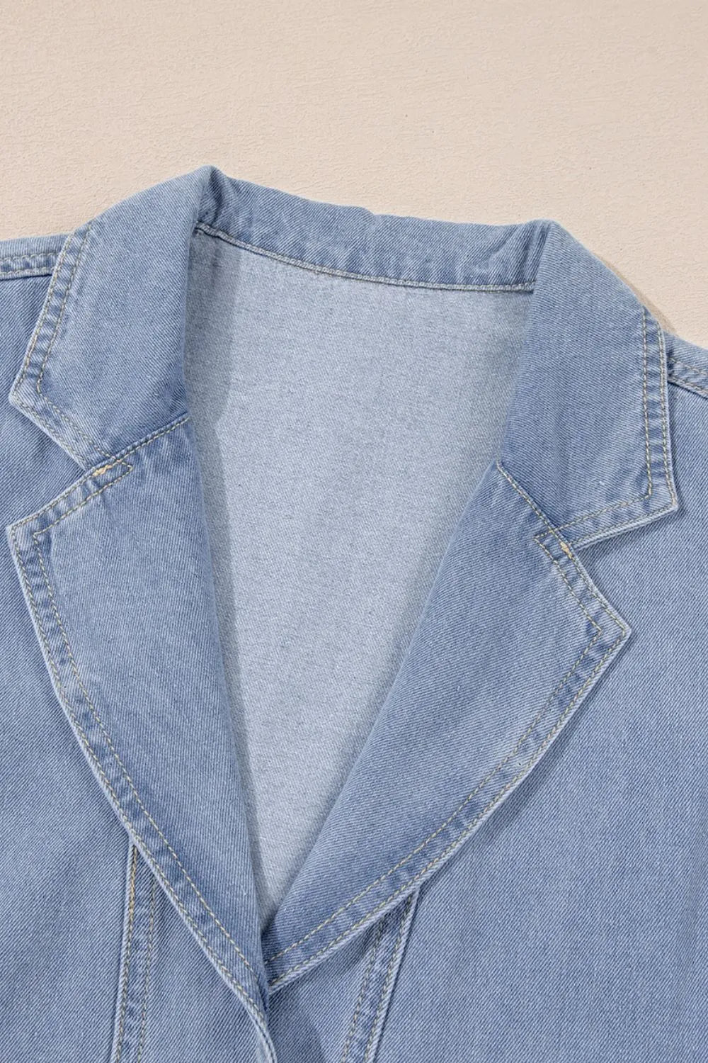 Medium-length denim babydoll dress with lapel collar and cap sleeves, stylish and casual by Trendsi.