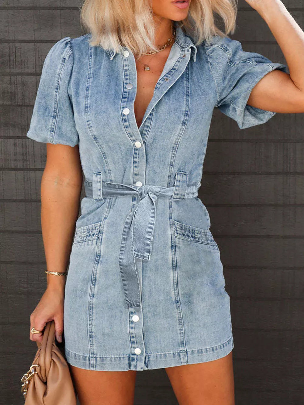 Medium-length puff sleeve button-up mini denim dress by Trendsi, showing a stylish casual dress with classic denim fabric and button details.