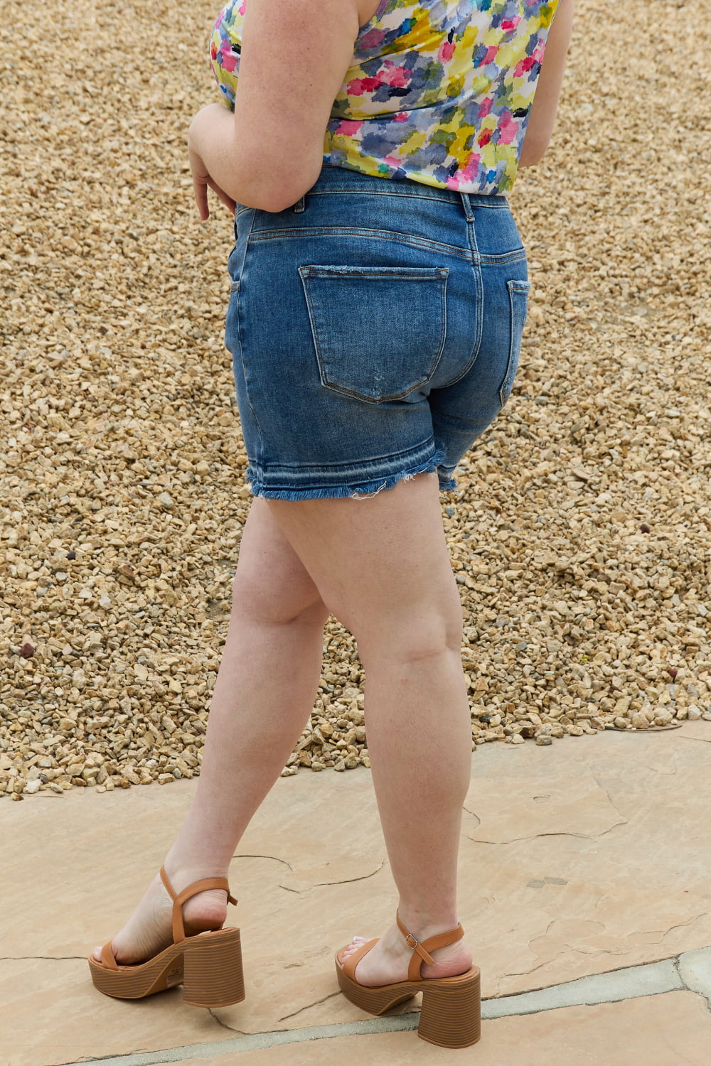 Mid-rise asymmetrical shorts by RISEN Maya, featuring a full size fit and trendy design, perfect for casual summer wear.