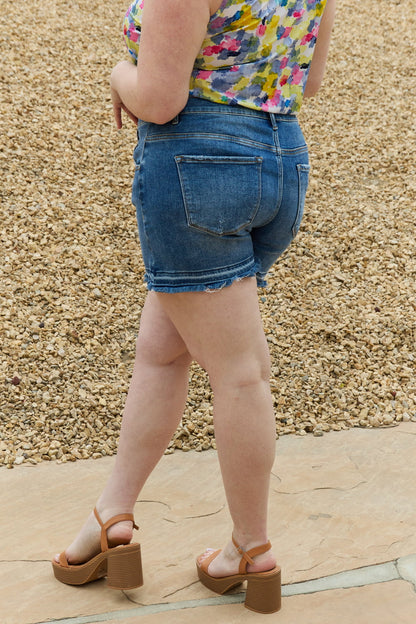 Mid-rise asymmetrical shorts by RISEN Maya, featuring a full size fit and trendy design, perfect for casual summer wear.