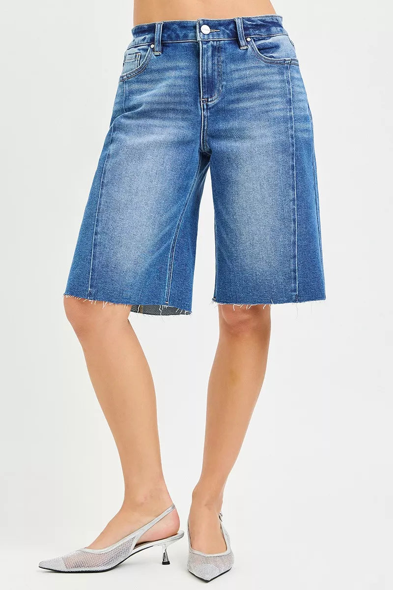 Medium shot of RISEN Raw Hem Slouchy Seamed Jorts by Trendsi, showing distressed raw hem and relaxed slouchy fit.