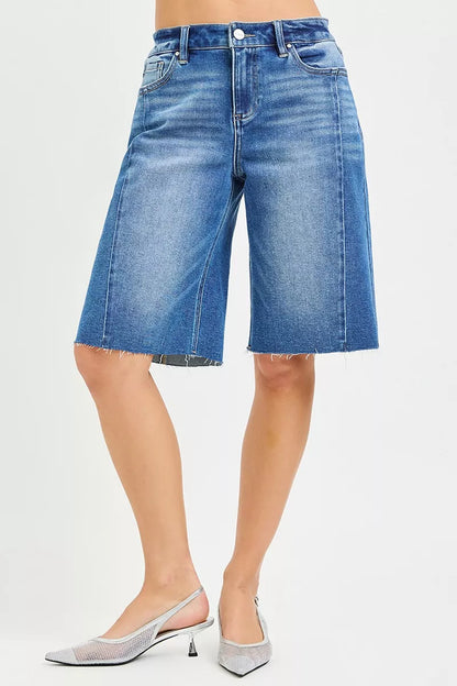 Medium shot of RISEN Raw Hem Slouchy Seamed Jorts by Trendsi, showing distressed raw hem and relaxed slouchy fit.
