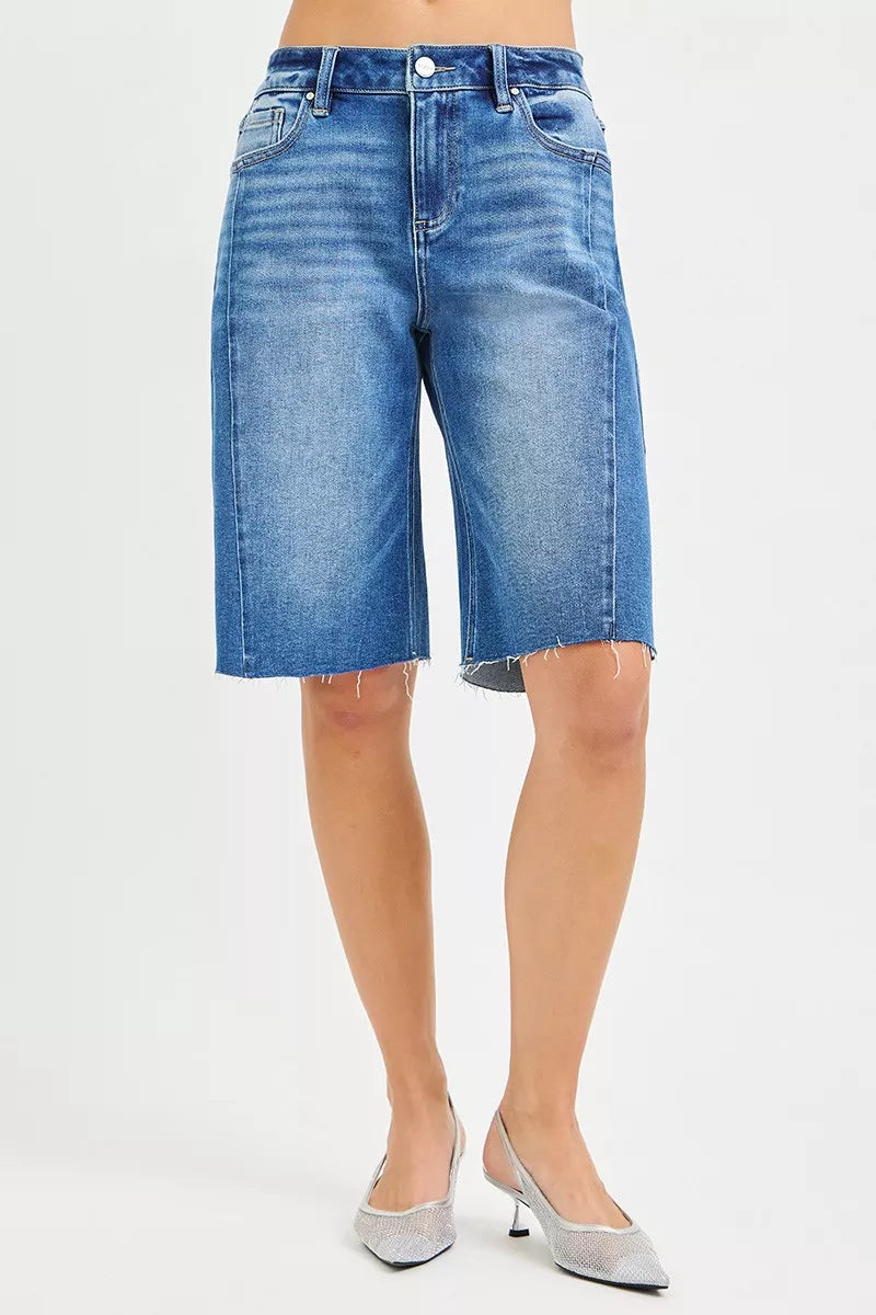 Light blue RISEN Raw Hem Slouchy Seamed Jorts by Trendsi with distressed raw hem and relaxed fit, showcased on a model.