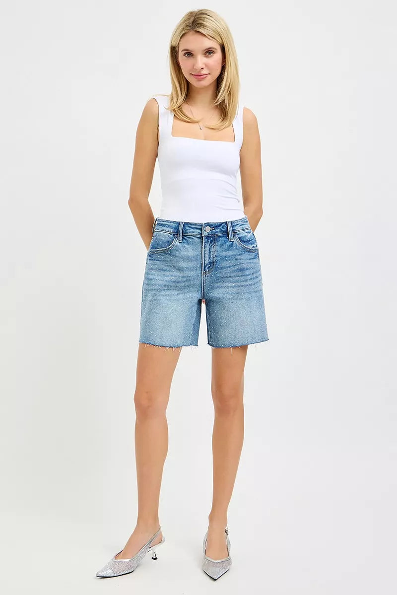 Risen slouchy mid-length shorts with all-over rhinestones, trendy fashion piece, casual yet sparkling style.