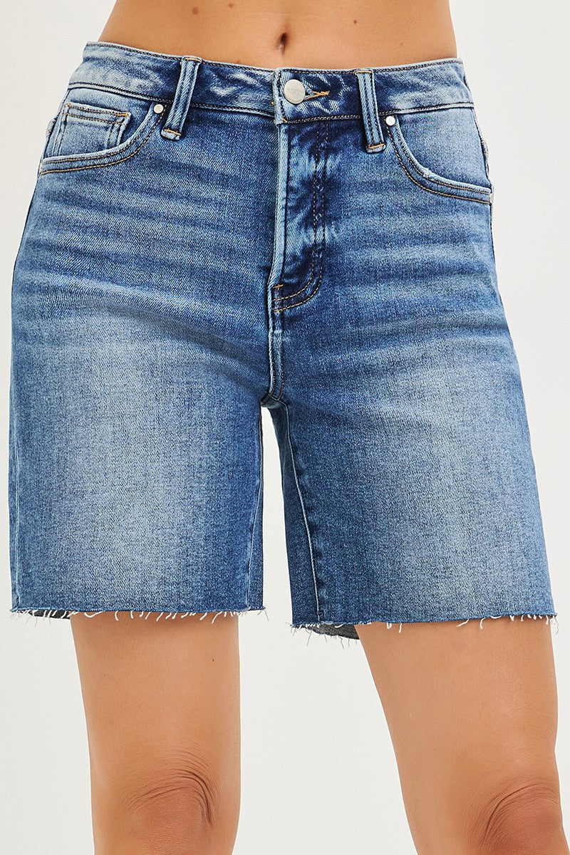Medium-length RISEN high-rise raw hem denim shorts by Trendsi featuring tummy control and distressed raw cut hem details.