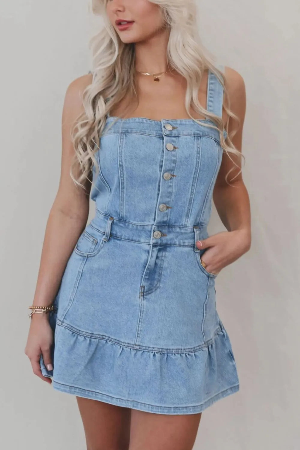 Light blue denim dress with ruffled hem, button front, and square neckline, featuring a trendy and casual style by Trendsi.