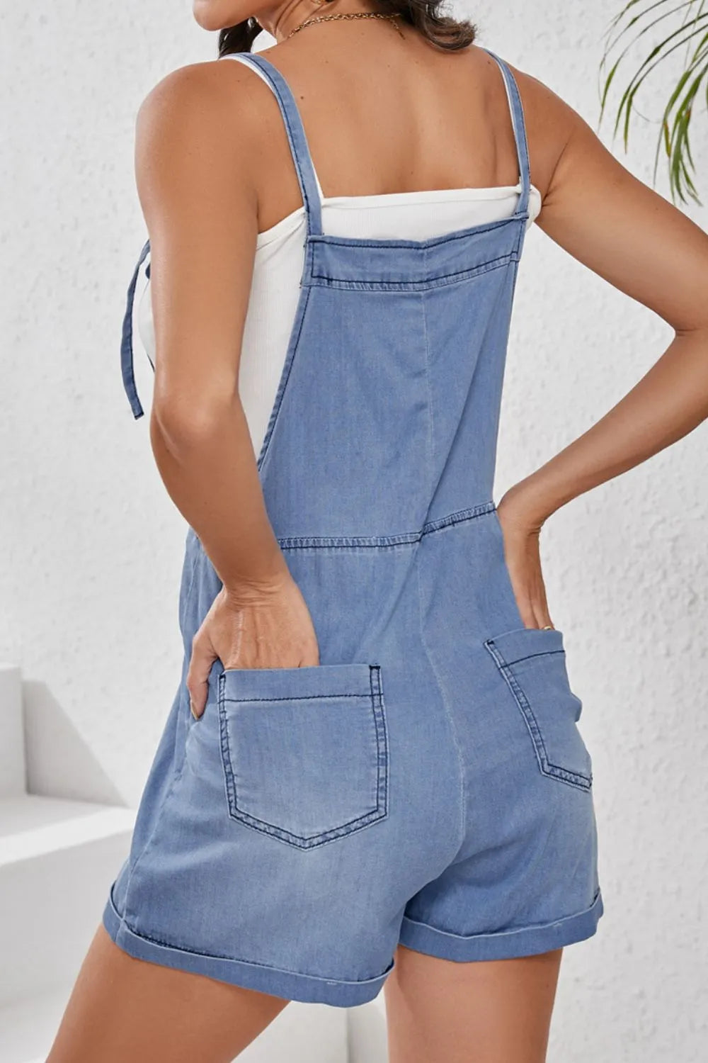 Square neck denim overalls by Trendsi featuring front pockets, made from classic blue denim fabric.