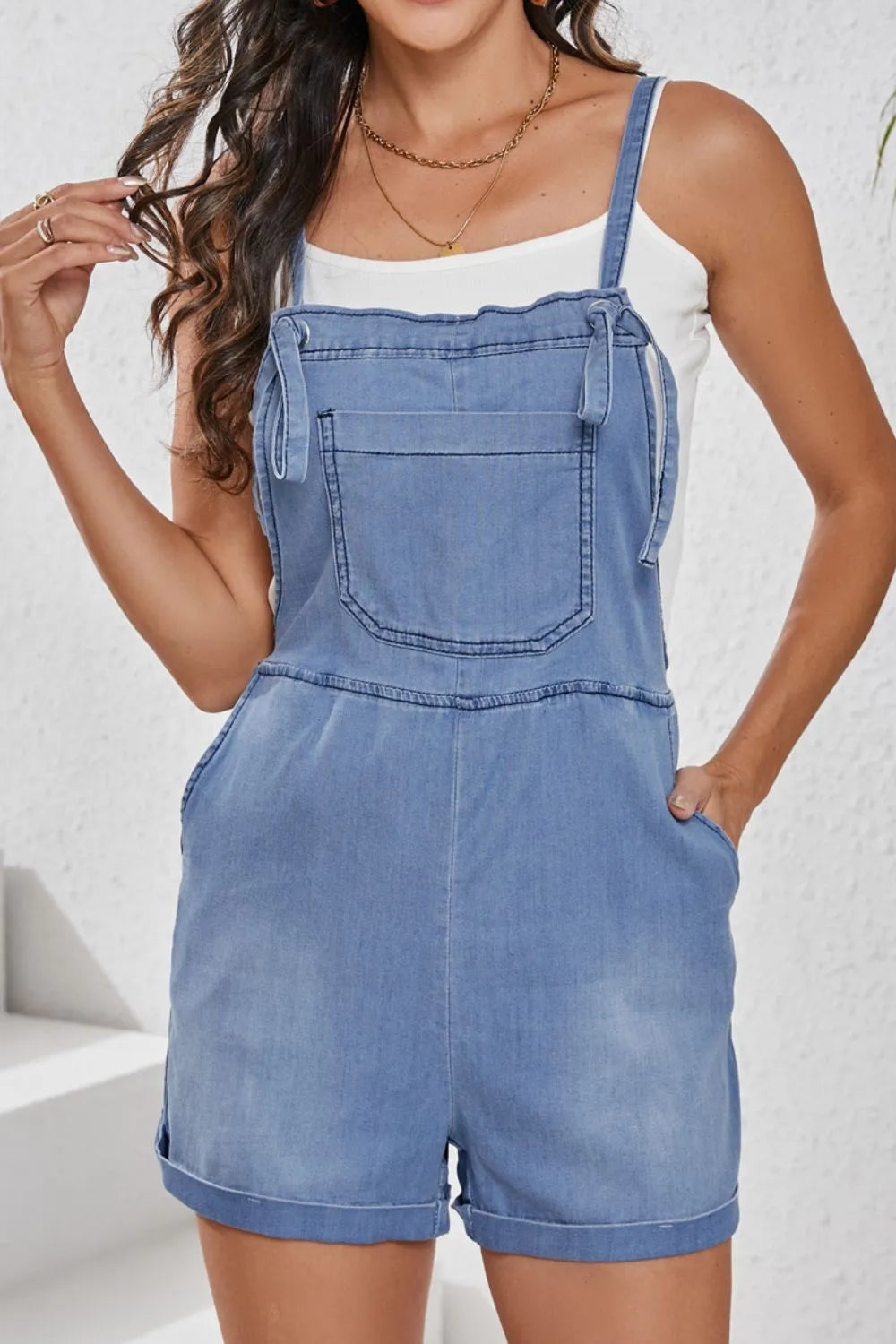 Light blue square neck denim overalls with front pockets, casual style, from Trendsi.
