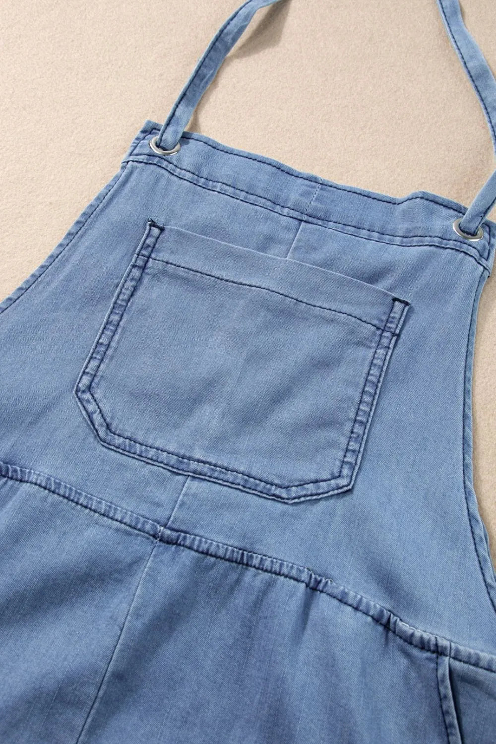 Square neck denim overalls with pockets from Trendsi, featuring a stylish fit and casual design on a model.