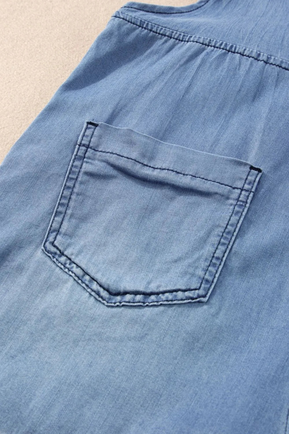 Medium-sized square neck denim overalls with front pockets, featuring a trendy design by Trendsi.
