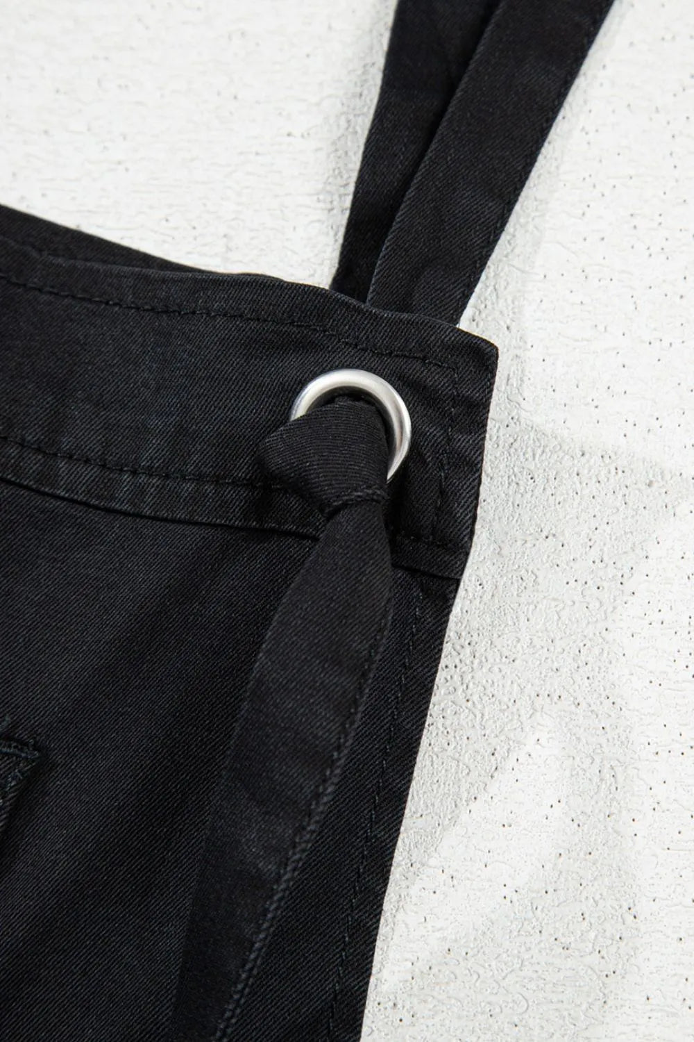 Medium shot of Trendsi square neck denim overalls with front pockets, featuring adjustable straps and a casual fit.