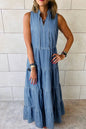 Medium image of Trendsi's tie neck tiered maxi denim dress featuring a stylish tie neckline and flowing tiered skirt.