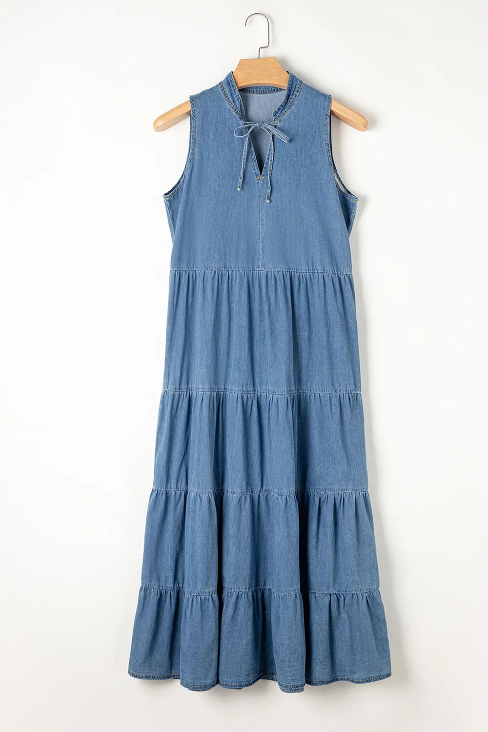 Medium-length tie neck tiered maxi denim dress by Trendsi featuring a flowy silhouette and ruffled tiers.