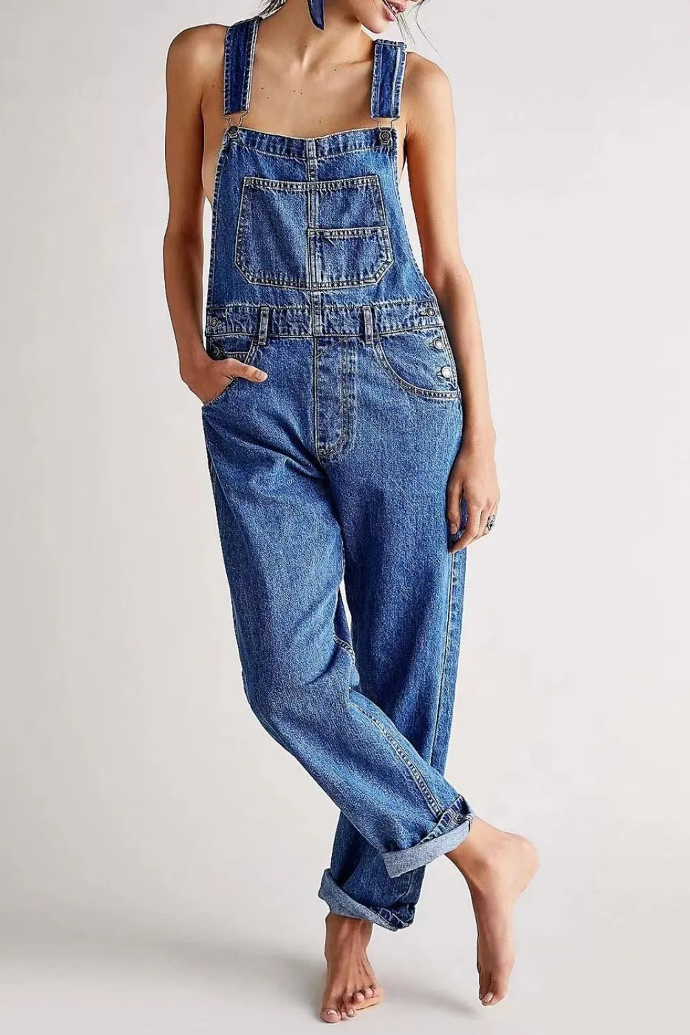 Medium blue denim wide strap square neck overalls with front pockets and adjustable straps, by Trendsi.