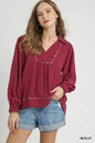 Plus size Umgee linen blouse with scallop hem and contrast trim, featuring a relaxed fit and stylish details.