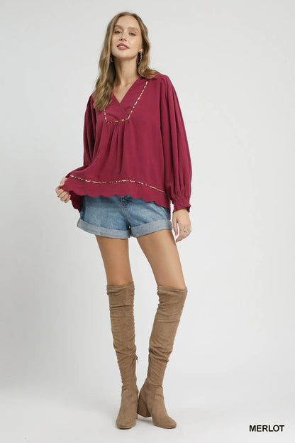 Plus size Umgee linen blouse with scallop hem and contrast trim, featuring a relaxed fit and stylish detail.