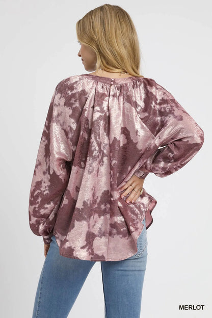 Metallic fabric blouse by Umgee with balloon sleeves, featuring a stylish and shiny design perfect for trendy outfits.