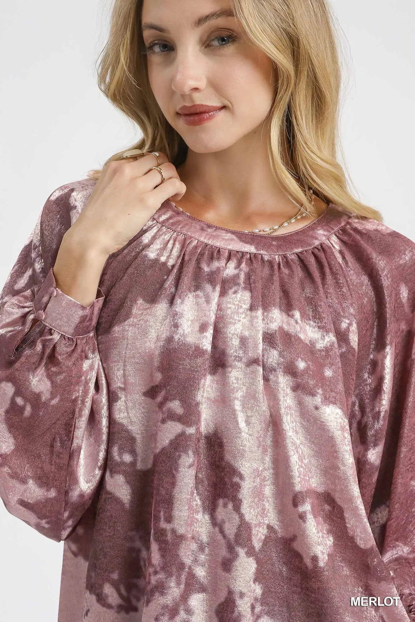Maroon Umgee metallic fabric blouse with balloon sleeves, stylish and flowy, shown on a model.