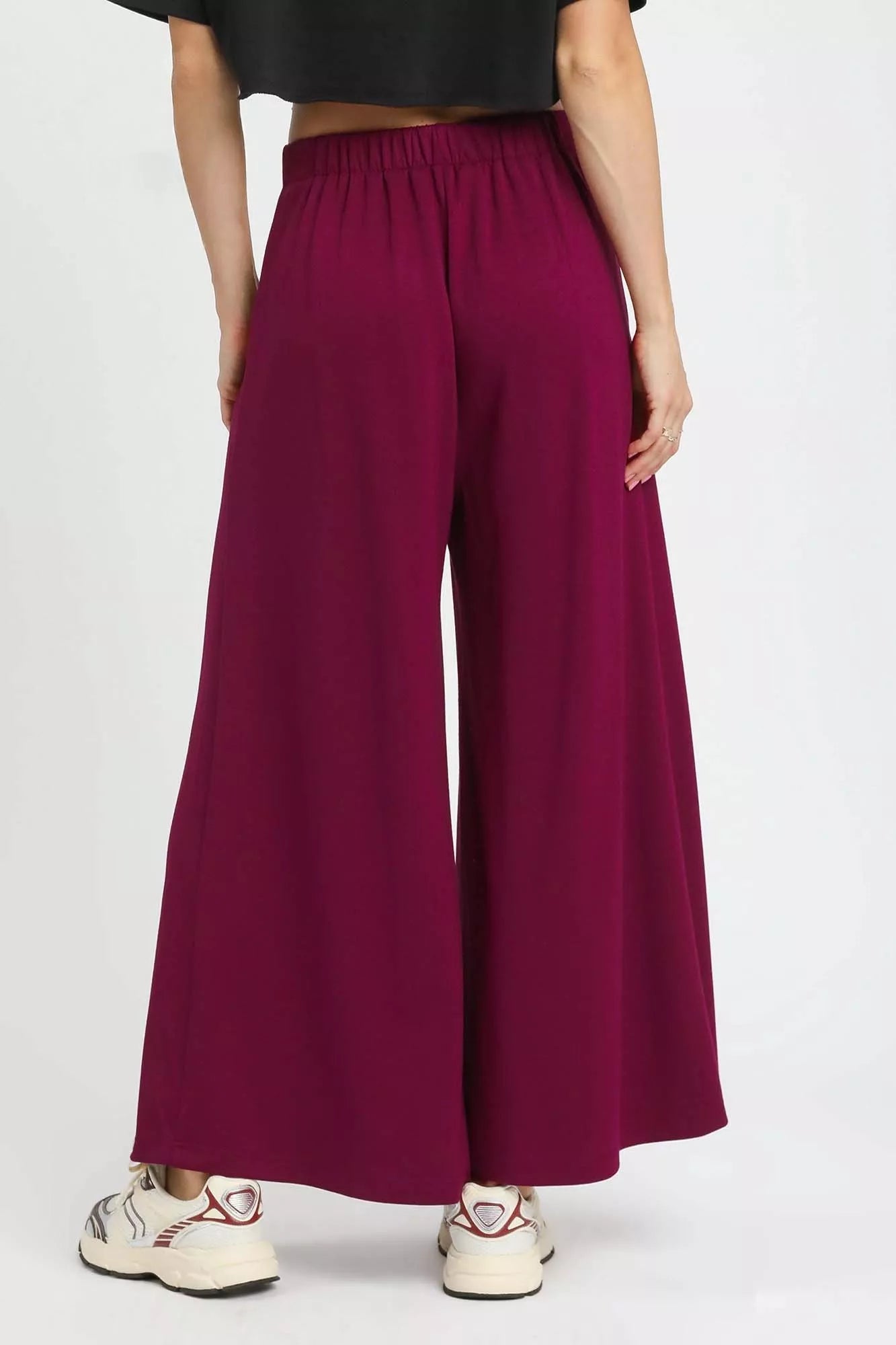 Merlot-colored Umgee wide leg pants with pockets, featuring a relaxed fit and stylish design, perfect for casual wear.