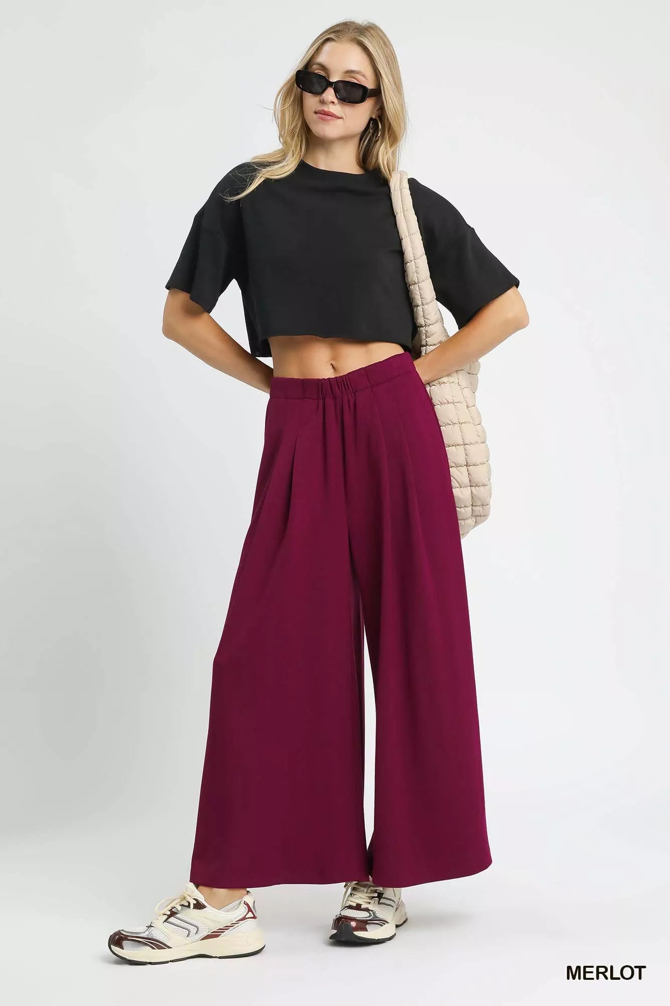 Trendsi Umgee wide leg pants in merlot with pockets, featuring a relaxed fit and casual style, shown on a model.