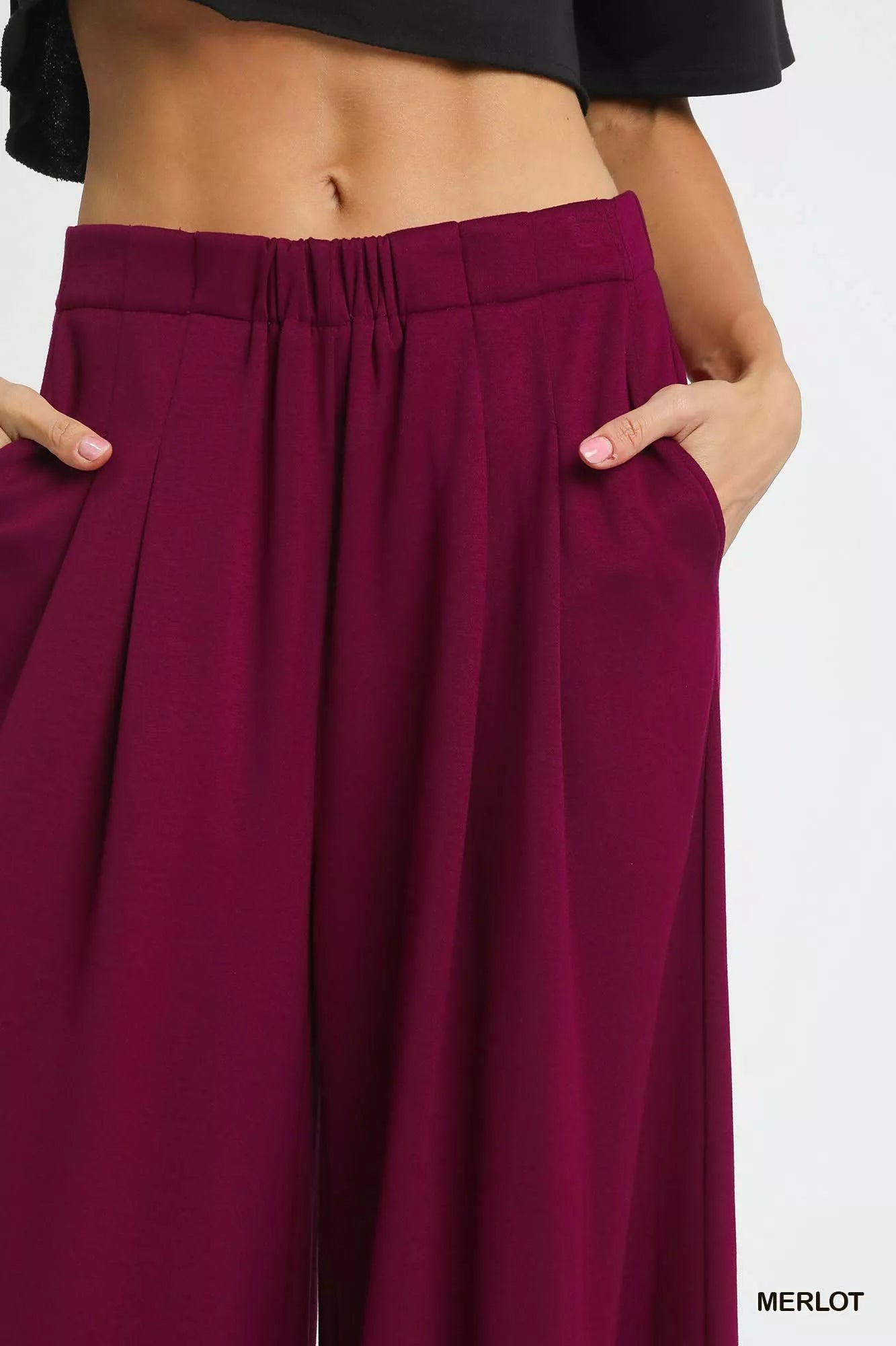 Umgee wide leg pants with pockets in merlot color, featuring a relaxed fit and stylish design.