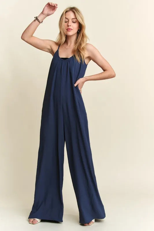 Midnight blue ADORA wide-leg casual cami jumpsuit from Trendsi, featuring a relaxed fit and sleeveless design.
