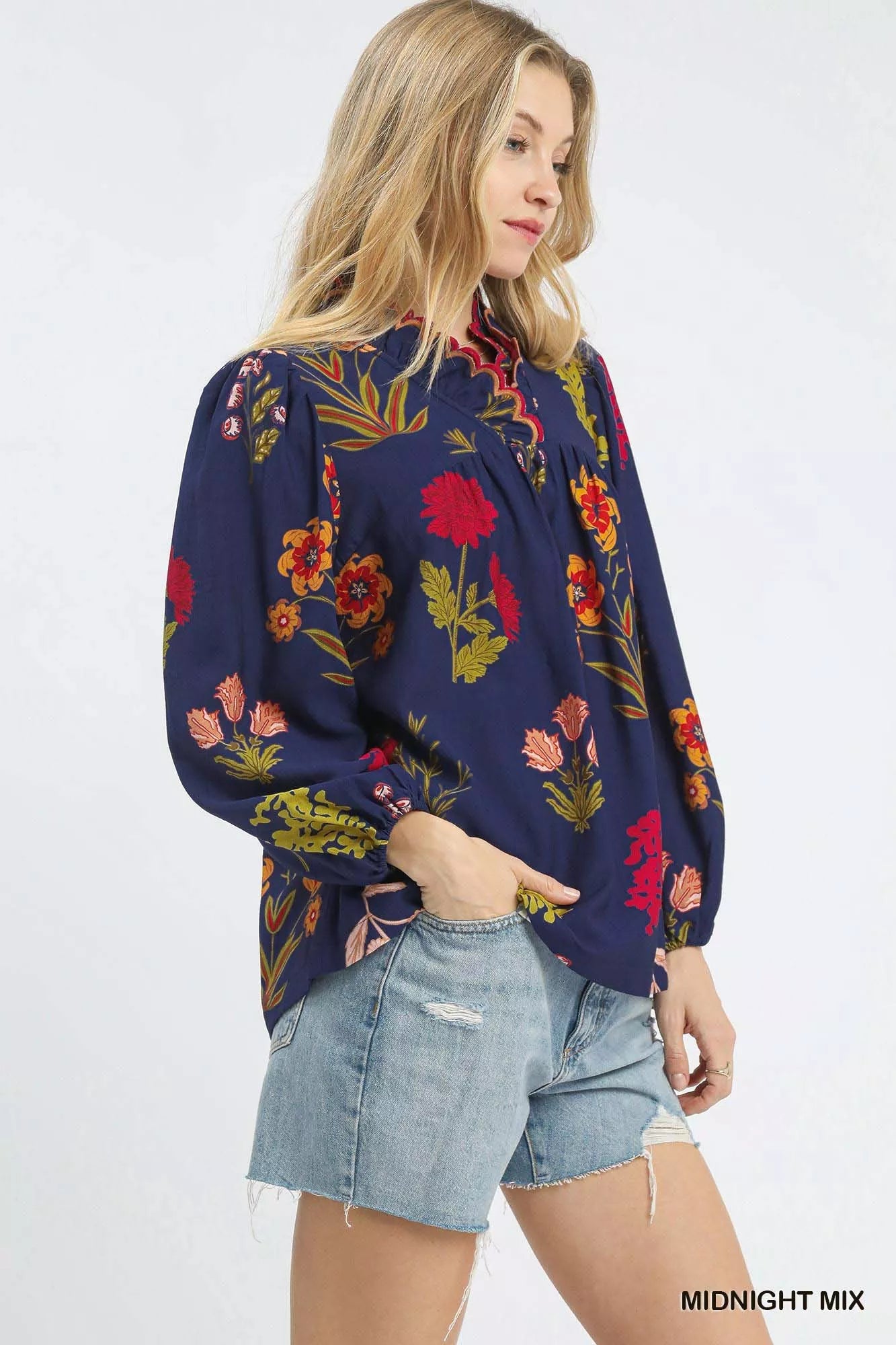 Umgee flower print blouse from Trendsi with scalloped neckline, featuring a midnight mix pattern and lightweight fabric.