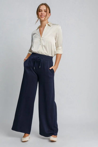 Midnight blue Umgee drawstring wide-leg pants with pockets, casual and comfortable for everyday wear.