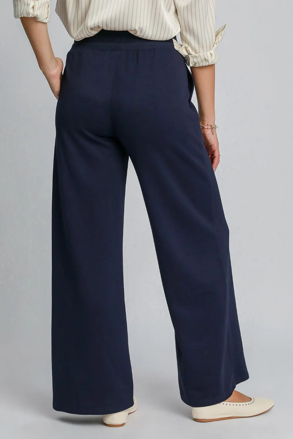 Midnight blue Umgee drawstring wide-leg pants with pockets, featuring a relaxed fit and casual style, by Trendsi.