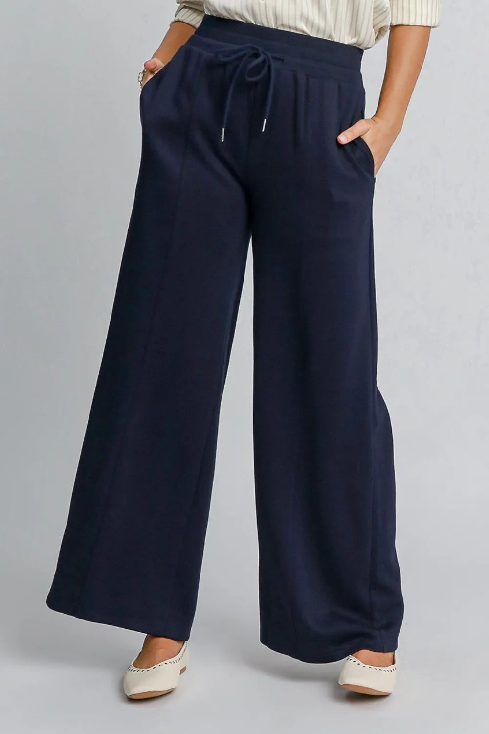 Midnight blue Umgee drawstring wide-leg pants with pockets, casual and comfortable, featuring relaxed fit and stylish design.