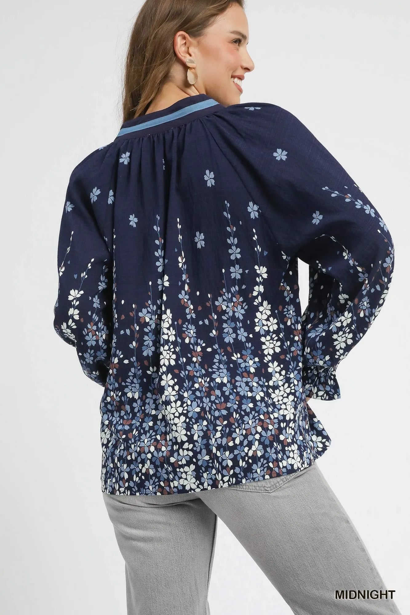 Plus size Umgee floral vine print blouse with balloon sleeves, featuring a full-length design and stylish details, by Trendsi.
