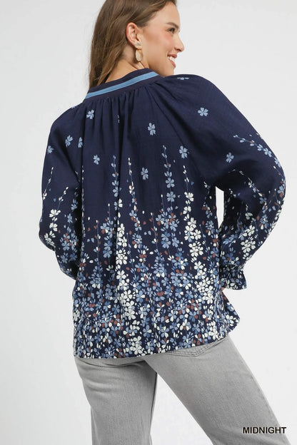 Plus size Umgee floral vine print blouse with balloon sleeves, featuring a full-length design and stylish details, by Trendsi.