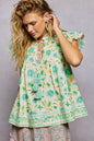Mint green floral flutter sleeve blouse with tassel ties from Trendsi, featuring romantic, lightweight fabric and flowy silhouette.