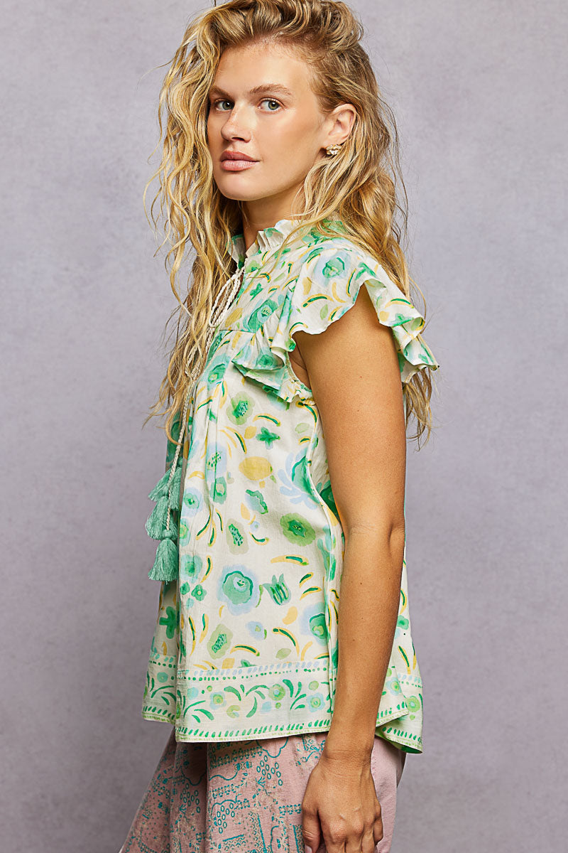 Mint green floral blouse with flutter sleeves and tassel tie detail, stylish trendy blouse from Trendsi.