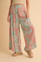 Mint pink Aemi+Co printed wide-leg pants with a relaxed fit, featuring a stylish floral pattern and lightweight fabric.